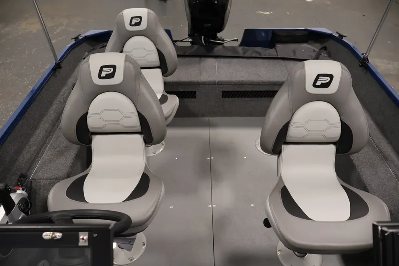 Slide: The Image of 2025 Princecraft Holiday 162 WS MAX boat interior with four gray seats. - 29
