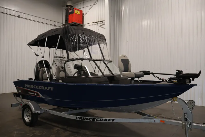 Slide: The Image of 2025 Princecraft Holiday 162 WS MAX boat on trailer in indoor setting. - 37