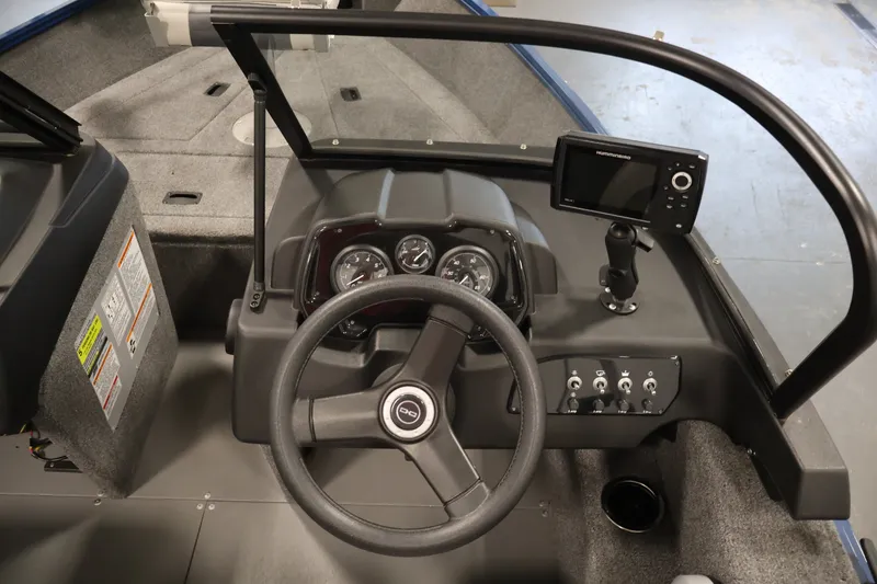 Slide: The Image of 2025 Princecraft Holiday 162 WS MAX boat dashboard with steering wheel and navigation controls. - 20