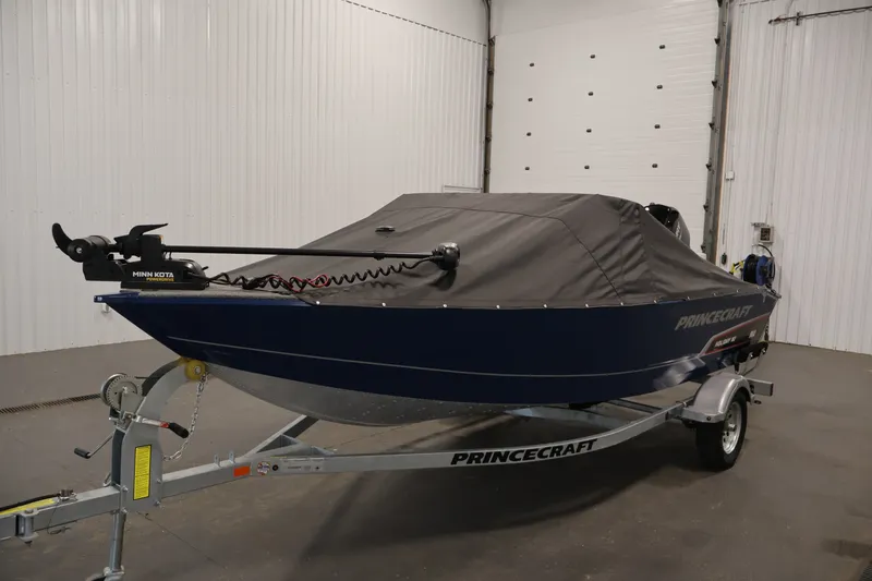 Slide: The Image of 2025 Princecraft Holiday 162 WS MAX boat with cover on trailer in garage. - 42