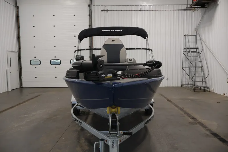 Slide: The Image of 2025 Princecraft Holiday 162 WS MAX boat in indoor storage, front view. - 2