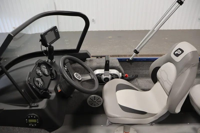 Slide: The Image of 2025 Princecraft Holiday 162 WS MAX boat interior with steering wheel and dashboard controls. - 19