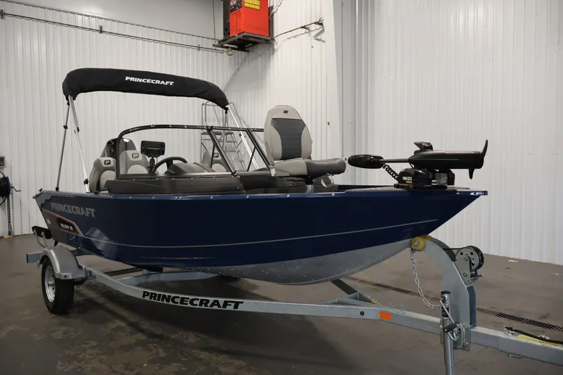 Slide: The Image of 2025 Princecraft Holiday 162 WS MAX boat on trailer in indoor setting. - 3