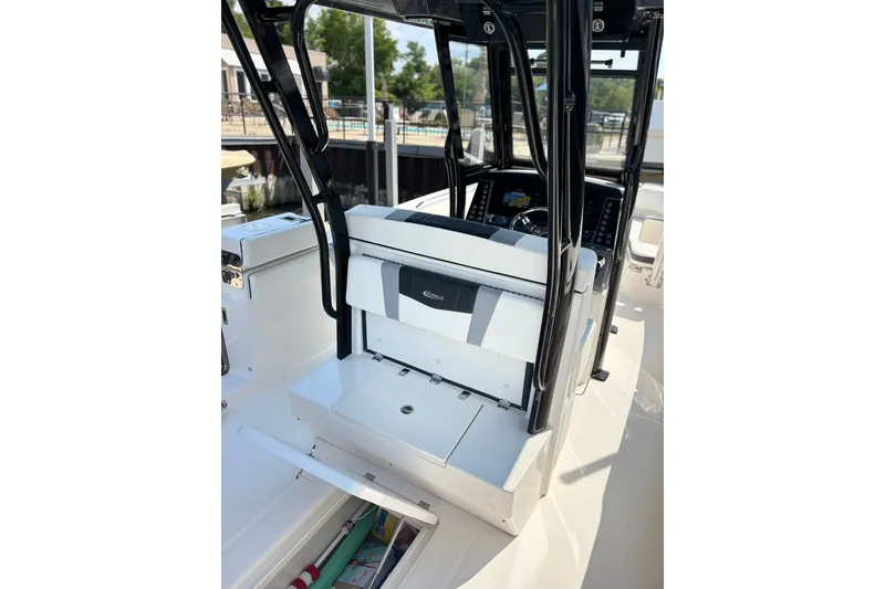 Slide: The Image of 2023 Robalo R272 Center Console boat interior with helm and seating area. - 43