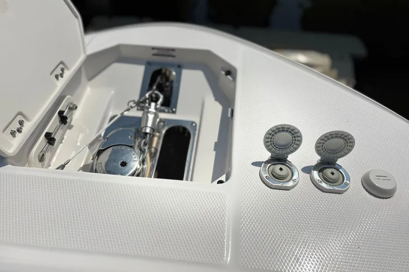 Slide: The Image of 2023 Robalo R272 Center Console boat deck with anchor and hatch details. - 49