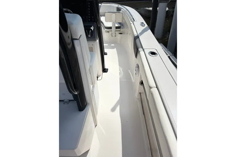 Slide: The Image of 2023 Robalo R272 Center Console boat interior with sleek white deck and seating. - 20