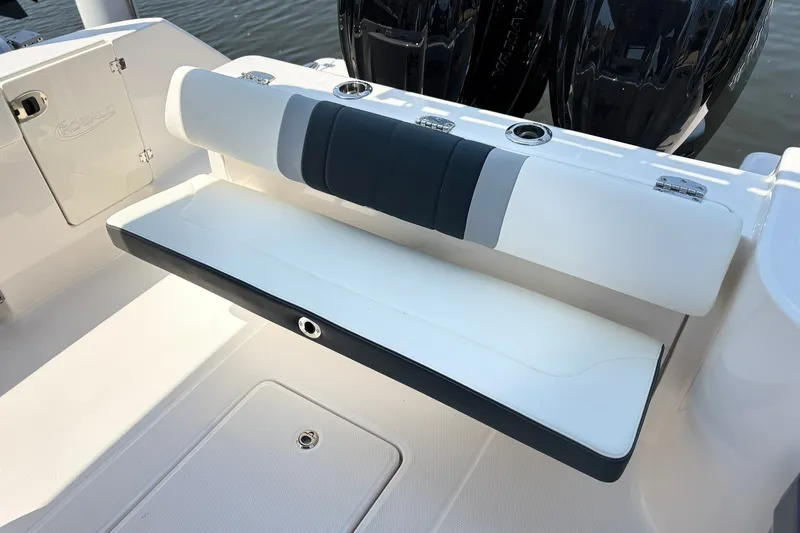 Slide: The Image of 2023 Robalo R272 Center Console boat seat with sleek design and cup holders. - 37