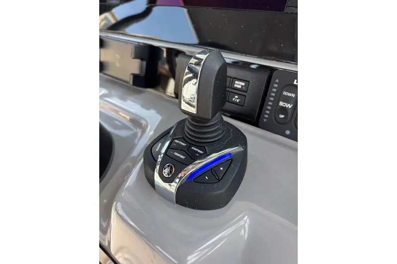 Slide: The Image of 2023 Robalo R272 Center Console joystick control on dashboard. - 29