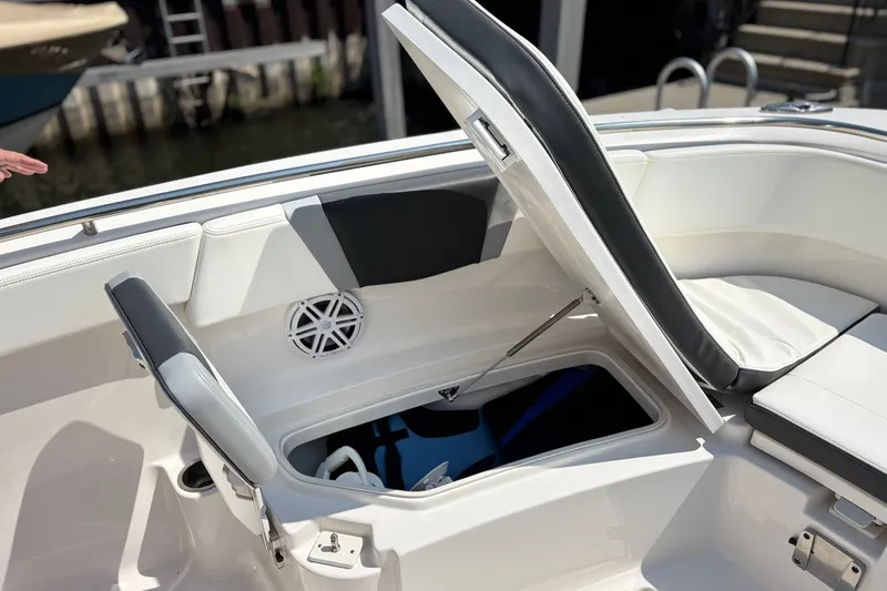 Slide: The Image of 2023 Robalo R272 Center Console boat with open storage compartment and seating. - 47