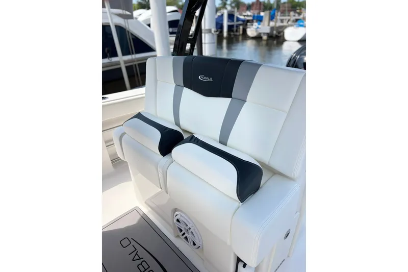 Slide: The Image of 2023 Robalo R272 Center Console boat seating with white and gray upholstery. - 25