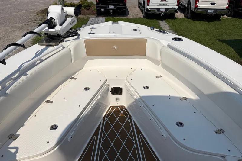 Slide: The Image of 2022 Edgewater 230CC boat interior with seating and storage compartments. - 5