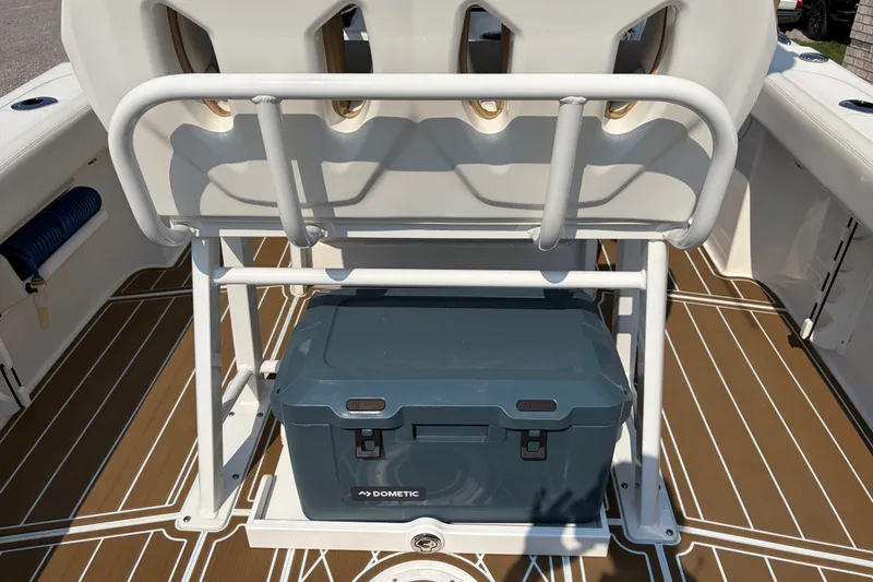 Slide: The Image of Edgewater 230CC 2022 boat interior with Dometic cooler and seating arrangement. - 19