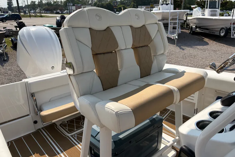 Slide: The Image of 2022 Edgewater 230CC boat interior with cushioned seating and modern design. - 18
