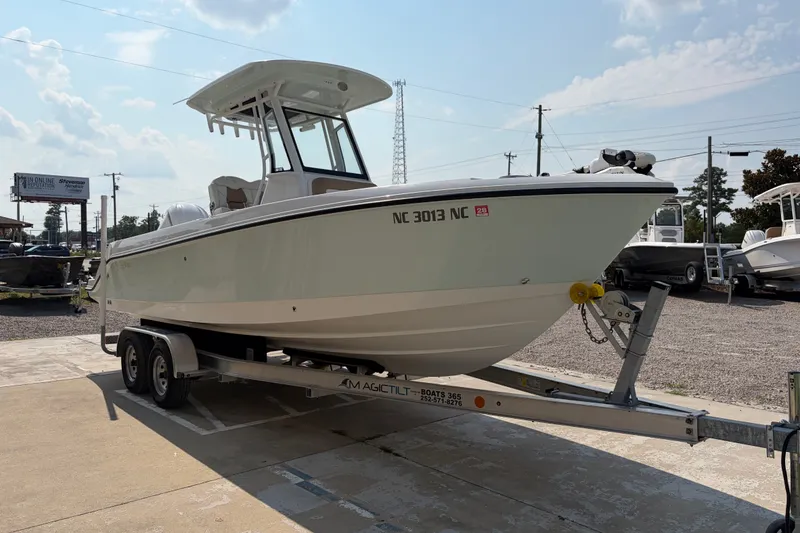 Slide: The Image of 2022 Edgewater 230CC boat on trailer in outdoor dealership lot. - 3