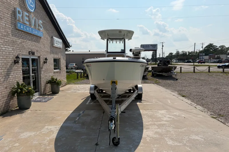 Slide: The Image of 2022 Edgewater 230CC boat on trailer at Revis Yacht Sales dealership. - 2