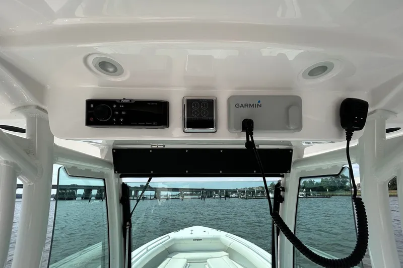 Slide: The Image of 2018 Everglades 273 Center Console boat dashboard with Garmin navigation system. - 2