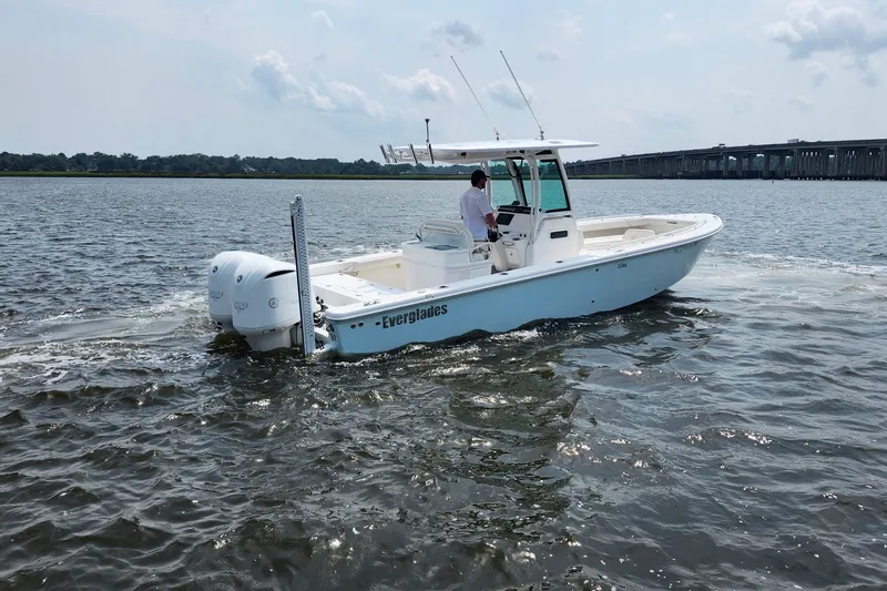 Slide: The Image of 2018 Everglades 273 Center Console boat cruising on open water. - 16