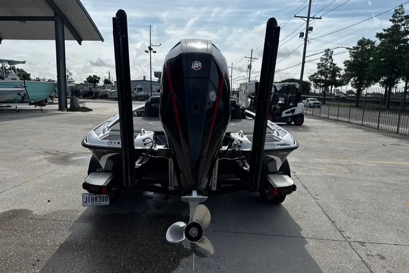 Slide: The Image of 2023 Phoenix 721 ProXP boat rear view with powerful outboard motor. - 8