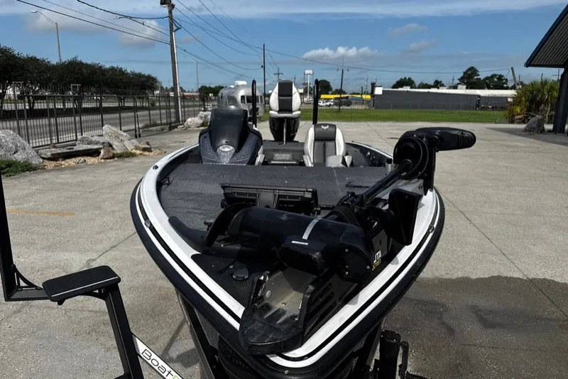 Slide: The Image of 2023 Phoenix 721 ProXP boat with advanced trolling motor, parked outdoors. - 7