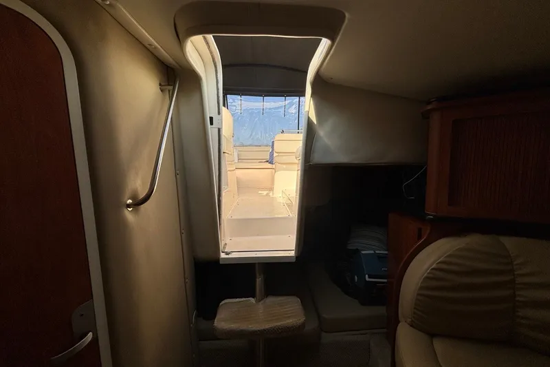 Slide: The Image of Interior view of 2003 Rinker Fiesta Vee 312 cabin with stairs leading to deck. - 21
