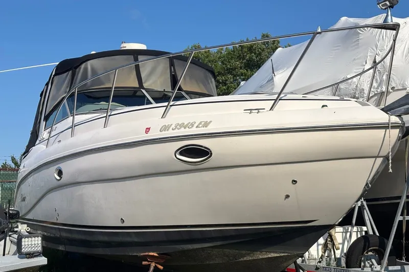 Slide: The Image of 2003 Rinker Fiesta Vee 312 boat on trailer, covered and ready for transport. - 3