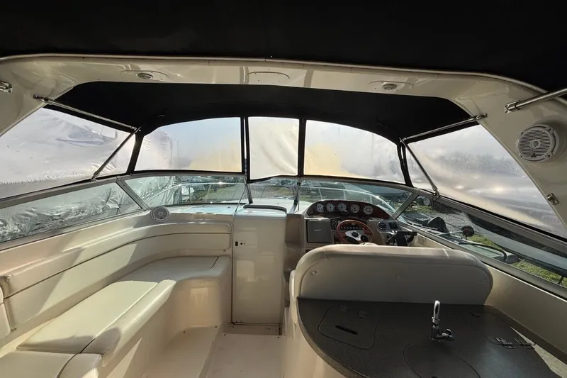Slide: The Image of Interior view of 2003 Rinker Fiesta Vee 312 boat, featuring helm and seating area. - 9