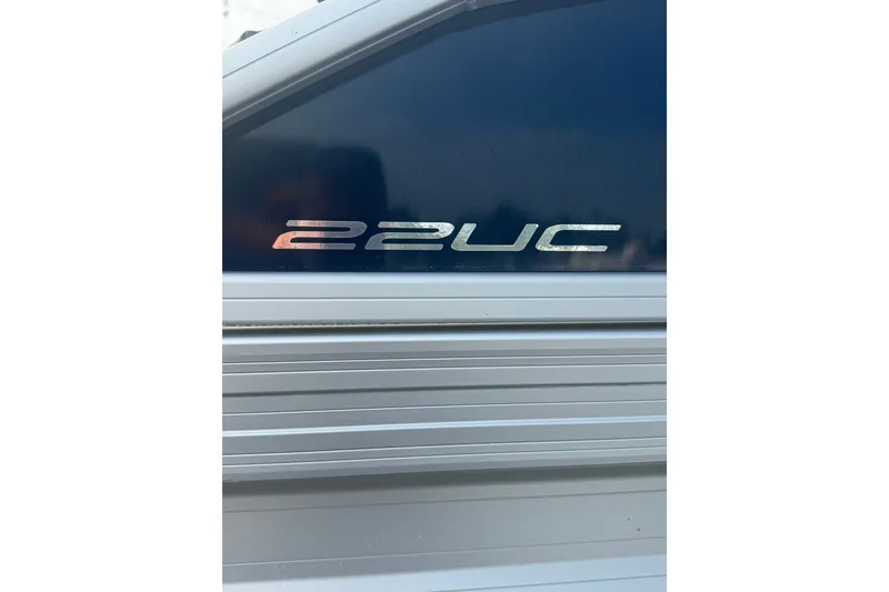 Slide: The Image of Close-up of 2024 Barletta A22UC model emblem on metallic surface. - 17