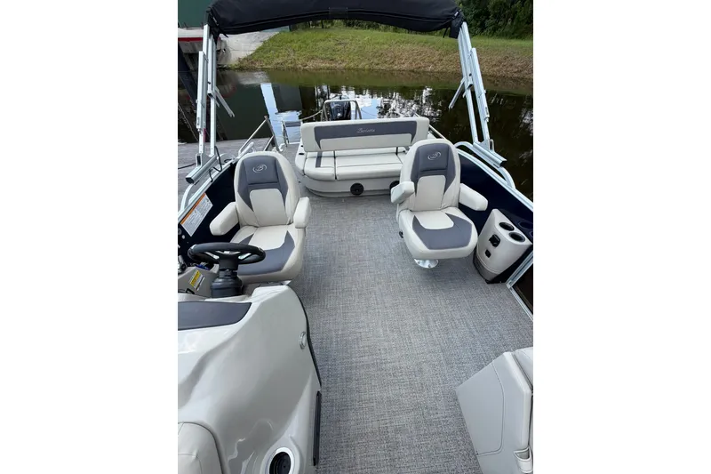 Slide: The Image of 2024 Barletta A22UC pontoon boat interior with plush seating and modern design. - 7