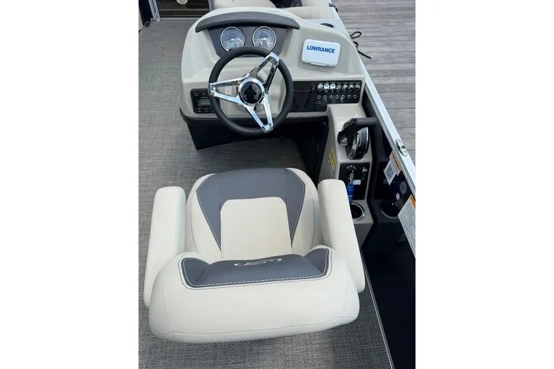 Slide: The Image of 2024 Barletta A22UC boat helm with steering wheel and control panel. - 8