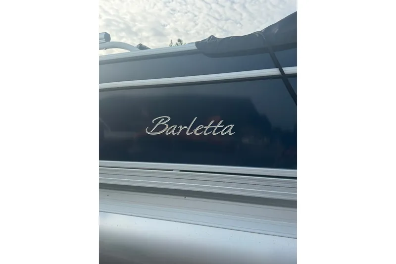 Slide: The Image of 2024 Barletta A22UC boat with sleek design and elegant branding. - 16