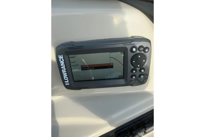 Slide: The Image of Lowrance GPS device on 2024 Barletta A22UC boat dashboard. - 22