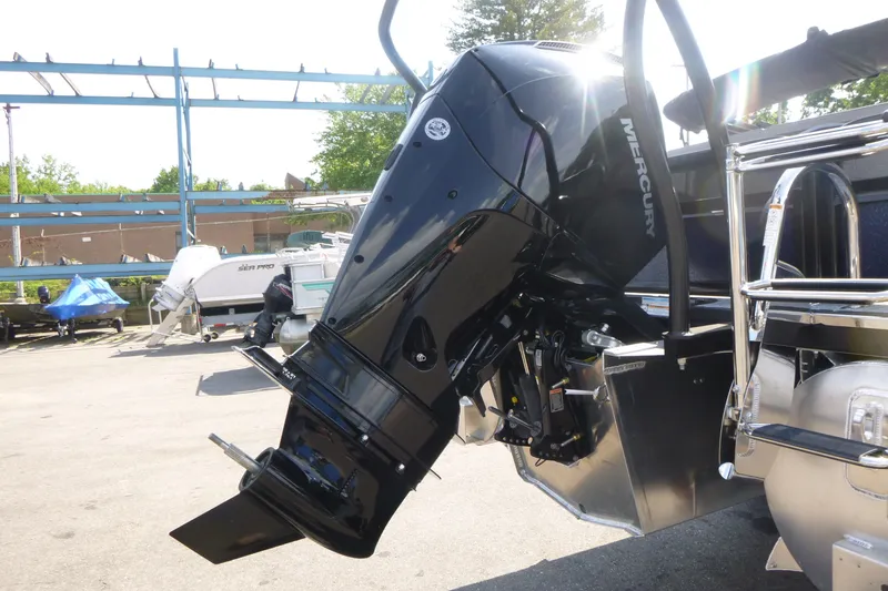 Slide: The Image of Premier 250 Sunsation RS - CL 2027 boat with Mercury outboard motor in a marina. - 14