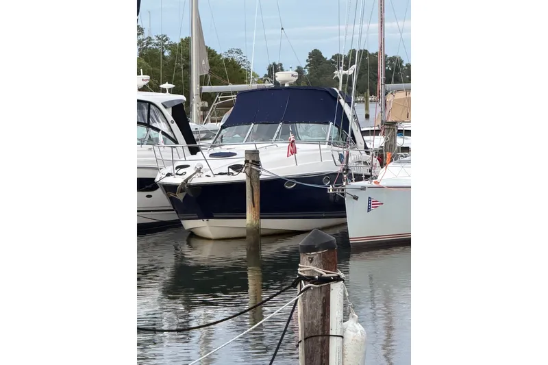 Slide: The Image of 2008 Monterey 330 Sport Yacht docked at marina, surrounded by other boats. - 7
