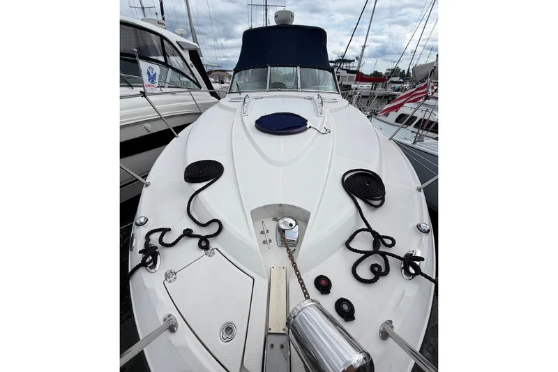 Slide: The Image of 2008 Monterey 330 Sport Yacht docked, showcasing sleek design and nautical equipment. - 5