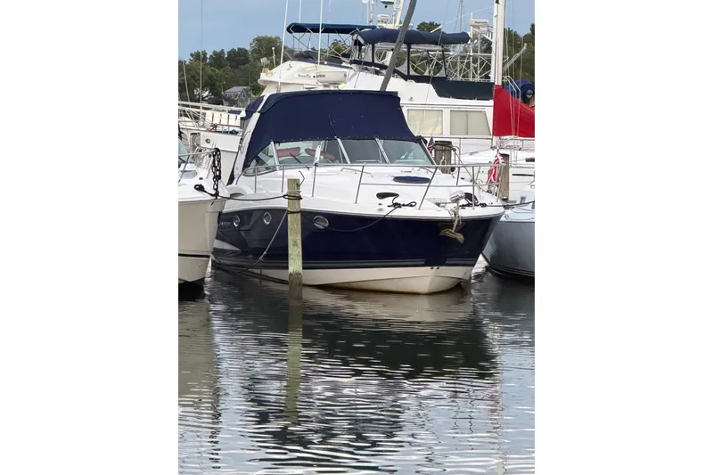 Slide: The Image of 2008 Monterey 330 Sport Yacht docked in a marina, surrounded by other boats. - 9