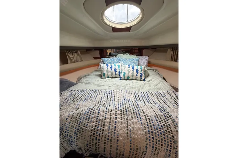 Slide: The Image of Cozy cabin interior of 2008 Monterey 330 Sport Yacht with decorative pillows and bedding. - 33