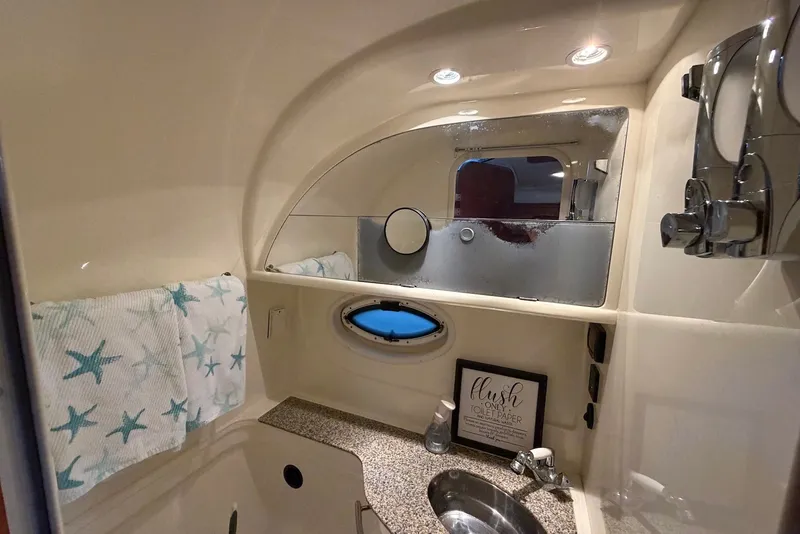 Slide: The Image of Bathroom interior of 2008 Monterey 330 Sport Yacht with starfish towels and modern fixtures. - 36