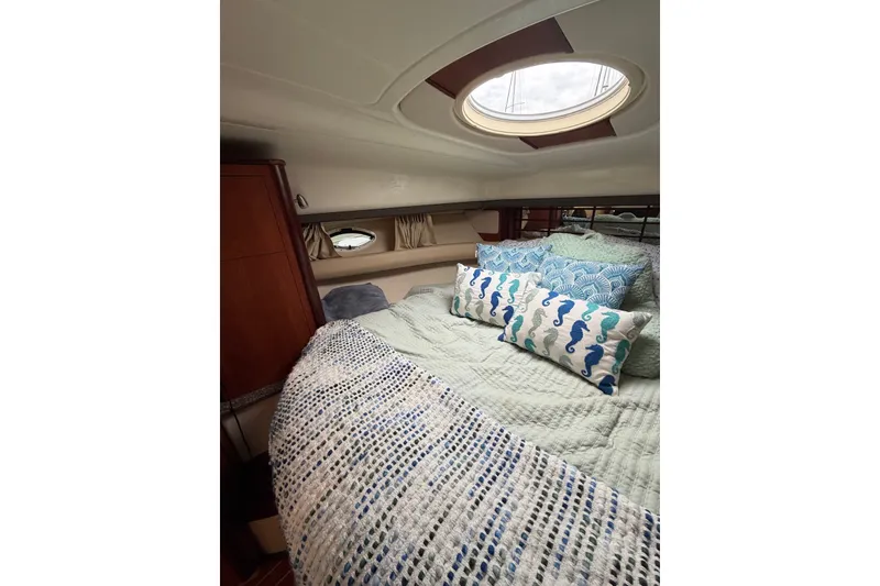 Slide: The Image of Interior of 2008 Monterey 330 Sport Yacht with cozy bedding and decorative pillows. - 32