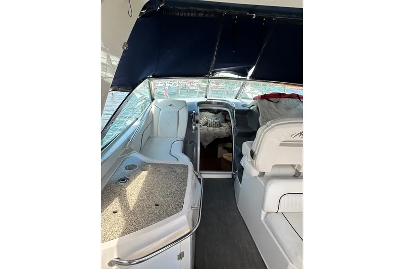 Slide: The Image of 2008 Monterey 330 Sport Yacht interior with seating and cabin view. - 10