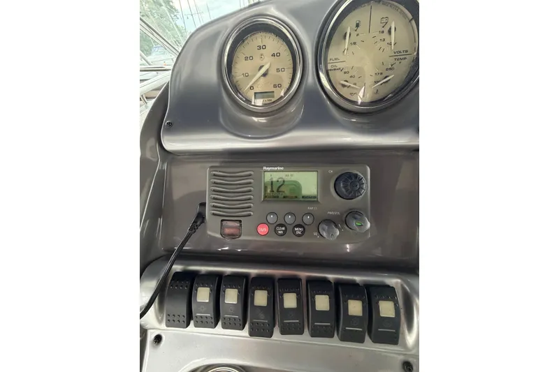 Slide: The Image of Dashboard of a 2008 Monterey 330 Sport Yacht with gauges and controls. - 17