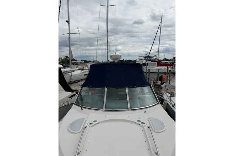 Slide: The Image of 2008 Monterey 330 Sport Yacht docked at marina under cloudy sky. - 4
