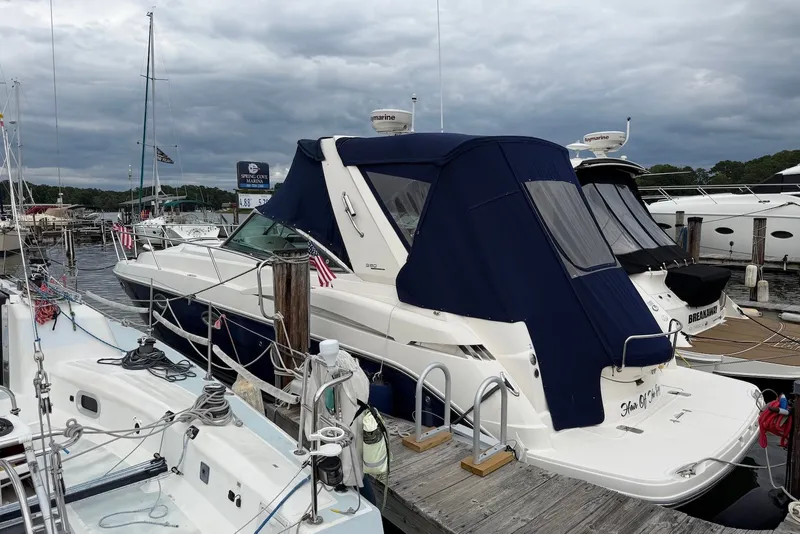 Slide: The Image of 2008 Monterey 330 Sport Yacht docked at marina with blue canopy. - 1