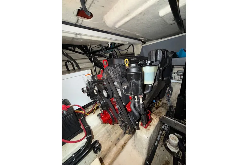 Slide: The Image of Engine compartment of a 2008 Monterey 330 Sport Yacht, showcasing mechanical components. - 43