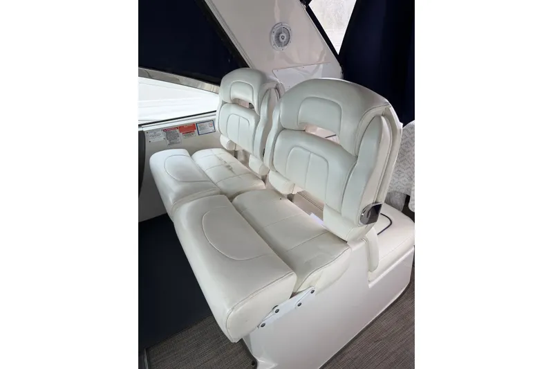 Slide: The Image of Luxurious white seating on a 2008 Monterey 330 Sport Yacht, showcasing comfort and style. - 18