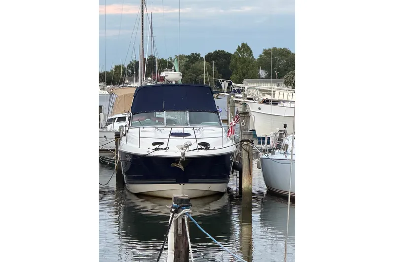 Slide: The Image of 2008 Monterey 330 Sport Yacht docked at marina, surrounded by other boats. - 8