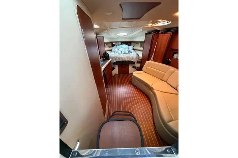 Slide: The Image of Interior of 2008 Monterey 330 Sport Yacht with cozy seating and elegant wood finishes. - 21