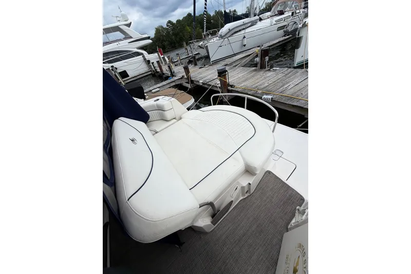 Slide: The Image of 2008 Monterey 330 Sport Yacht at dock, featuring white seating and sleek design. - 15