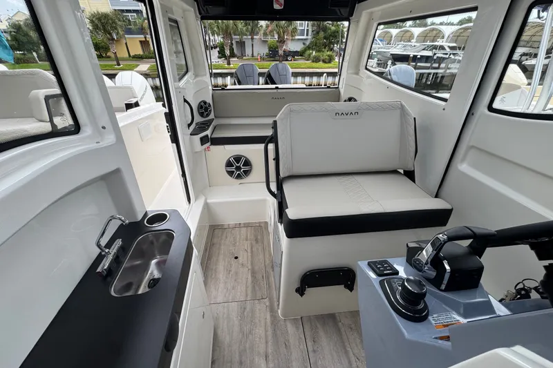 Slide: The Image of Interior of 2026 Navan C30 boat with seating, sink, and control panel. - 20