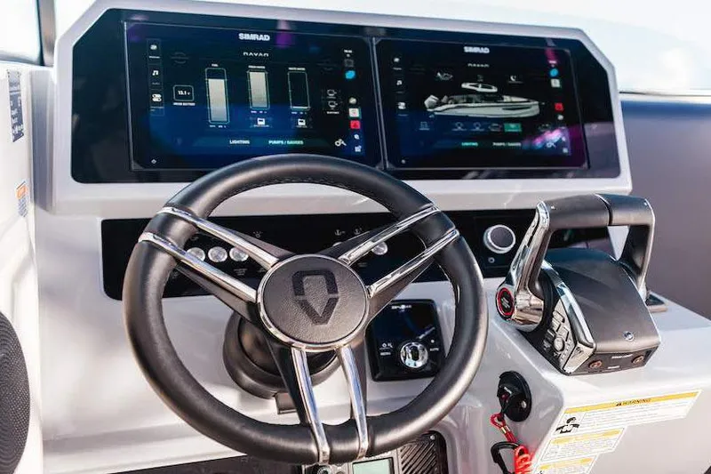 Slide: The Image of Manufacturer Provided Image: Steering wheel and control panel of 2026 Navan C30 boat with digital displays. - 17