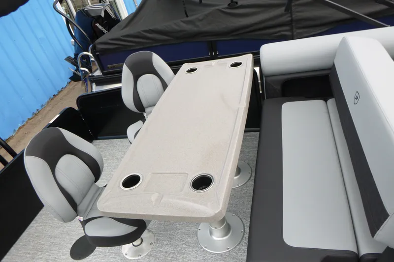 Slide: The Image of Interior of 2027 Premier 230 Sunsation RS - CL boat with seating and table setup. - 17